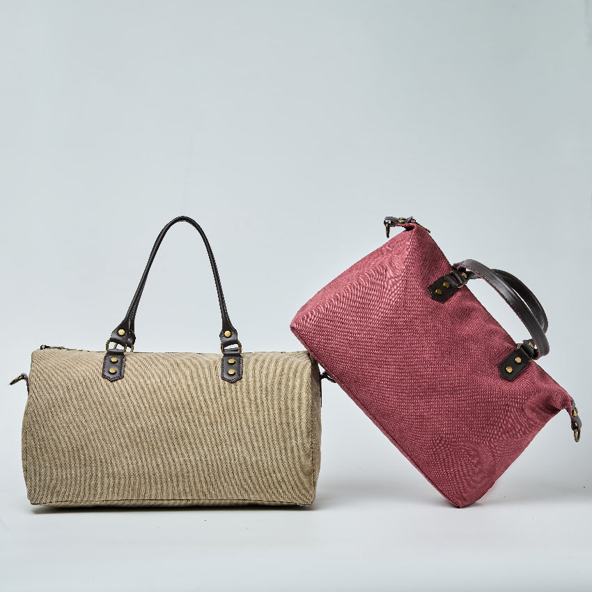 Two handbags, one beige and one red, on a light gray background